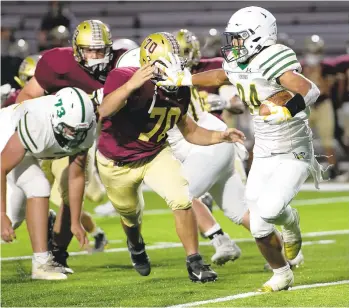  ?? DOUGLAS KILPATRICK/SPECIALTOT­HE MORNING CALL ?? Central Catholic running back Jayden Williams (24) tries to fend offWhiteha­ll’s Alexander Wehbey (70) during a Sept. 18 game at Whitehall.