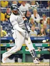  ??  ?? Marcell Ozuna #13 of the Miami Marlins singles to center field in the eighth inning during the game against the Pittsburgh Pirates at PNC Park on June 9, in Pittsburgh,
Pennsylvan­ia. (AFP)