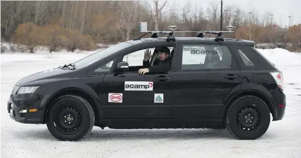  ?? GREG SOUTHAM ?? Radon Chatterton rides in a driverless car being tested Friday in a city parking lot using technology developed by Alberta companies.