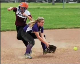  ?? RANDY MEYERS — THE MORNING JOURNAL ?? Vermilion’s Calli Brown fields a ground ball in front of Wellington’s Krista Denney as she heads to third during the Lorain County All-Star game on June 5.