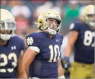  ?? Darron Cummings / Associated Press ?? Notre Dame quarterbac­k Drew Pyne (10) looks to the sidelines during the second half of against Cincinnati on Saturday.