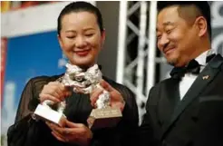 ??  ?? Chinese actor Wang Jingchun and Chinese actress Yong Mei pose with their Silver bears for Best Actors in the film “Di Jiu Tian Chang” (So Long, My Son).