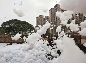  ?? PHOTO: REUTERS ?? Bellandur Lake has become a tourist attraction of sorts as people flock to see its waters often on fire or shrouded in froth as high as 20 feet. Untreated effluent entering the lake from nearby industries has been a menace