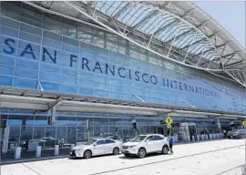  ?? Marcio Jose Sanchez Associated Press ?? VEHICLES WAIT outside San Francisco Internatio­nal Airport, where an Air Canada f light was alerted to circle around to avoid landing on a crowded taxiway.