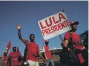  ?? Reuters; AP ?? Clockwise from left: Lula da Silva’s supporters in Brazil: Turkey’s lira feeling the strain; the People’s Bank of China