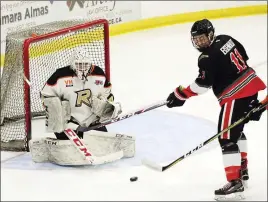  ?? Special to The Herald ?? KIJHL/
Noah Eisenhut of the Summerland Steam tries to redirect the puck past Castlegar Rebels goalie Justin Faiella during a KIJHL game in 2019-20.