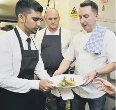  ??  ?? James Mackenzie makes sure the food is ready to go.164320h