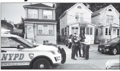  ?? ?? ‘TWO IN ONE MONTH’: Police stand in a Jamaica street where Domantea McDonald, 4, was fatally hit by an SUV. The boy and his family had just returned from the funeral of his 18-year-old brother, Tysheem (above with Domantea), who was shot and killed two weeks earlier.