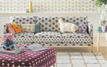  ?? ANTHROPOLO­GIE ?? Featuring a geometric print and cast iron legs, the Linde sofa has a chic midmod Italian profile.