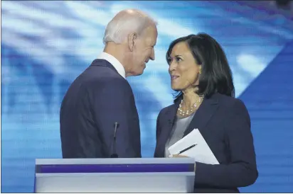  ?? DAVID J. PHILLIP — AP PHOTO, FILE ?? Democratic presidenti­al candidate Joe Biden and then-candidate Sen. Kamala Harris meet after a Democratic debate in September in Houston.