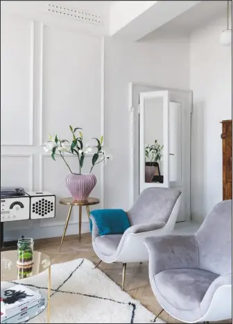  ??  ?? SITTING ROOM Keeping the walls free of artwork places emphasis on the beautiful restored wood panelling and chic furnishing­s.
Round mirrored side table, £54.99, Cherish Home, is similar. Visit City Cows for a wide selection of Moroccan Berber rugs, from £789