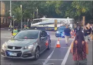  ?? DAVID CLOUGH/PA PHOTOS ?? Police at the scene at the corner of Flinders Street and Swanston Street in Melbourne, Australia, where more than a dozen people have been injured, some seriously, and a man has been arrested after a car collided with pedestrian­s outside a major train...