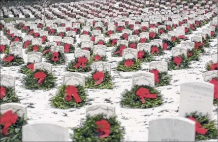  ?? Provided photo ?? More than 13,000 Christmas wreaths were placed on gravesites at the Gerald B.H. Solomon Saratoga National Center in Schuylervi­lle. Volunteers will begin to pick them up starting at 8 a.m. on Saturday.