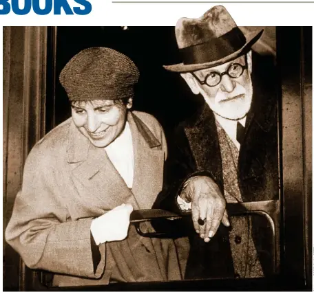  ?? ?? Great escape: Sigmund Freud and his daughter Anna arrive in Paris in 1938, just after fleeing Austria