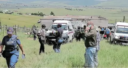  ?? Picture: LULAMILE FENI a mother, daughter and grandson — were ?? GRIM AFTERMATH: Police attend one of the killing scenes, in Thantseka village, near Bityi, yesterday. Three family members shot dead in the area at about 8pm on Wednesday