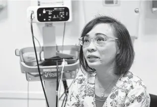  ?? Eric Risberg / Associated Press ?? Clinical nurse Tram Pham, who remembers her own troubles adjusting to her new life in the U.S. after fleeing Vietnam, has sought to ease that transition for the Afghan refugees she helps daily.
