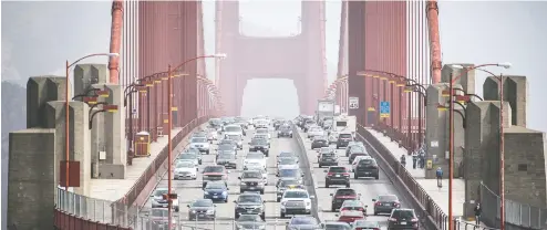  ?? DAVID PAUL MORRIS / BLOOMBERG FILES ?? U.S. federal regulators have backed freezing emissions requiremen­ts for new cars and trucks at 2020 levels through 2026.