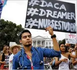  ?? JACQUELYN MARTIN / AP ?? Carlos Esteban, 31, of Woodbridge, Va., a nursing student and beneficiar­y of the Obama-era program that protected young immigrants, rallies at the White House.