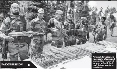  ??  ?? PAK OBSESSION Army soliders display a huge cache of arms and ammunition recovered by army in North Kashmir’s Rajwar forests, in Handwara.