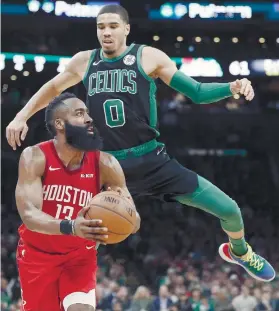  ?? AP FOTO ?? GOT YOU FLYING. James Harden goes for a three as Jayson Tatum defends. Harden made six threepoint­ers and finished with 40 points.