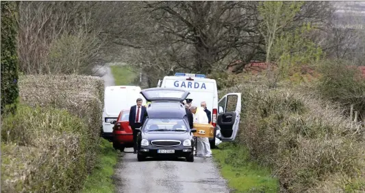  ?? Photo by Domnick Walsh ?? Gardaí removing the remains of Anthony O’Mahony from the scene where he died early on Tuesday morning in what Gardaí now believe to have been a murder.