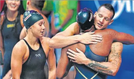  ?? GETTY IMAGES ?? Caeleb Dressel of USA (right) celebrates the win in mixed 4x100m freestyle final at the world championsh­ips in Budapest.