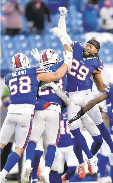  ??  ?? Bills cornerback Josh Norman celebrates with teammates after beating Colts in Buffalo on Saturday.