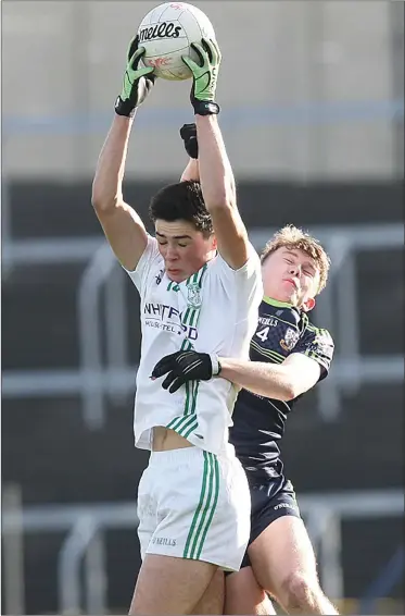  ??  ?? Man of the match Barry O’Connor makes a spectacula­r catch over the head of Moate’s Dan Heavin.