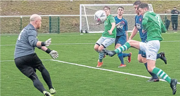  ??  ?? Action from last week’s Premiershi­p North clash between Lochee Harp (green shirts) and Carnoustie Panmure, with the Gowfers running out 6-1 winners.