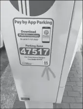  ?? PARKHOUSTO­N/COURTESY ?? An arrow points to a phony QR code found on a parking station in Houston in January.