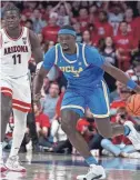  ?? DARRYL WEBB/AP ?? UCLA’s Adem Bona (3) starts a fast break after stealing the ball from Arizona’s Oumar Ballo (11) during the first half on Saturday in Tucson, Ariz.