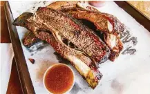  ?? J.C. Reid ?? Louie Mueller Barbecue in Taylor is renowned far and wide for its beef ribs. If a pitmaster has a checkered past, will the public go with its, er, gut in deciding where to eat?