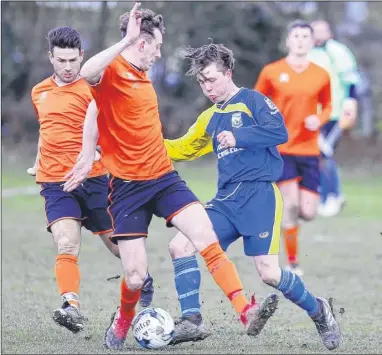  ?? Picture: Andy Jones FM5068932 Buy this picture from kentonline.co.uk ?? Snodland Town (blue) find themselves crowded out by Park Royal in their Premier Division clash on Sunday