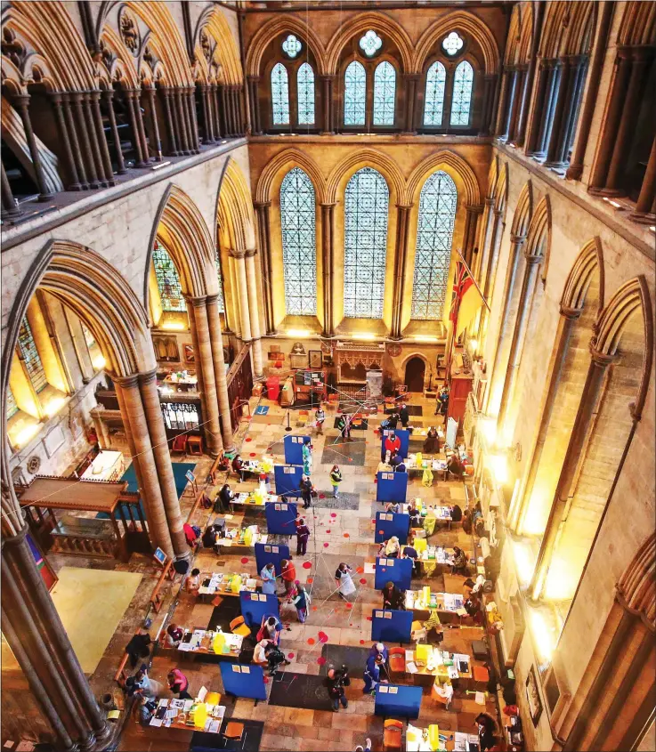  ??  ?? LOFTY AMBITION: The busy – and historic – scene in the cathedral nave yesterday, where cubicles were set up as part of the plan to give 1,000 over-80s and health workers the Pfizer BioNtech jab
