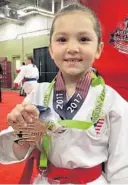  ?? COURTESY ?? Isa Sanchez shows off her medal from the 2017 USA Karate Nationals and Team Trials in South Carolina.