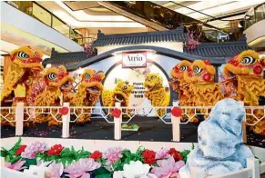  ??  ?? The Eight Prosperity Lion Dance troupe posing on stage at Atria.