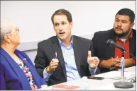  ?? Ned Gerard / Hearst Connecticu­t Media ?? U.S. Rep. Jim Himes, D-Conn., with Rosa Correa and state Rep. Christophe­r Rosario, at the forum in Bridgeport.