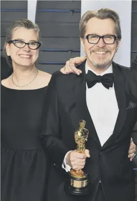  ??  ?? 0 Gary Oldman, with wife Gisele Schmidt, clutches his Oscar while, top right, best supporting actor Sam Rockwell, best actress winner Frances Mcdormand and best supporting actress Allison Janney celebrate. Above, Emma Watson arrives at the Vanity Fair...