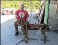  ??  ?? Welder and fabricator James Hackett of Lakeville entered a handsomely created horse formed with reclaimed metal bars.