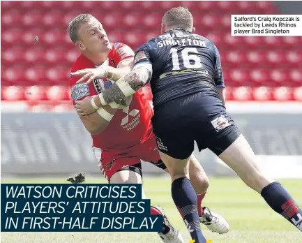  ??  ?? Salford’s Craig Kopczak is tackled by Leeds Rhinos player Brad Singleton