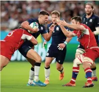  ??  ?? Kirill Gotovtsev tackles soon-to-be team-mate Adam Hastings during the 2019 World Cup