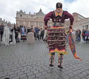  ?? ALESSANDRA TARANTINO/AP ?? An Indigenous artist from Canada performs in St. Peter’s Square at the Vatican on Friday. Many Indigenous people met with the pope.