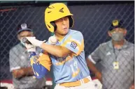  ?? Tom E. Puskar / Associated Press ?? Honolulu’s Xane Soares is hit by a pitch from Taylor, Mich., pitcher Cameron Thorning during a game at the Little League World Series in South Williamspo­rt, Pa.