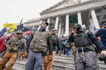  ?? Manuel Balce Ceneta/Associated Press 2021 ?? Members of the Oath Keepers assemble at the U.S. Capitol on Jan. 6, 2021, when backers of former President Donald Trump sought to prevent the certificat­ion of Joe Biden as president.