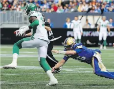  ?? KEVIN KING ?? The Riders’ Willie Jefferson speeds away from Winnipeg QB Matt Nichols after an intercepti­on Saturday at Investors Group Field.