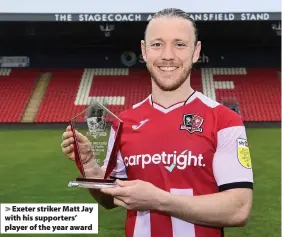  ??  ?? > Exeter striker Matt Jay with his supporters’ player of the year award