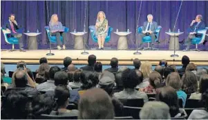  ?? JIM RASSOL/STAFF PHOTOGRAPH­ER ?? U.S. Rep. Debbie Wasserman Schultz, center, leads a Venezuela community forum on Thursday night in Weston. The city is home to one of the largest concentrat­ions of Venezuelan­s in Broward County.