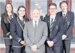  ??  ?? Leaders
Captains and vice- captains with head teacher Peter Gilchrist