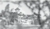  ?? J. DAVID AKE/AP ?? President Donald Trump’s Mar-a-Lago estate is seen behind mangrove trees in Palm Beach.