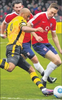  ?? Picture: Steve Terrell ?? Delano Sam-Yorke looks to deliver a cross for the visitors